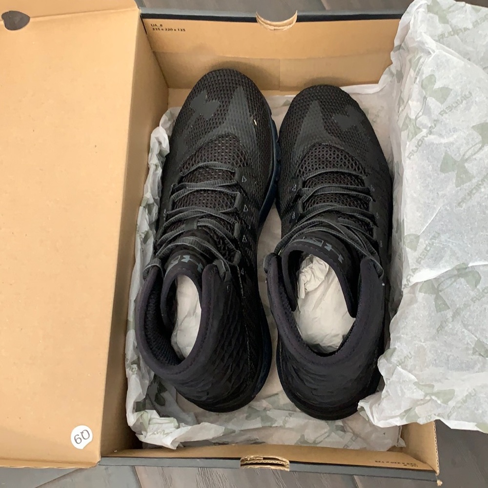 Brand new!! Under Armour black high top sneakers